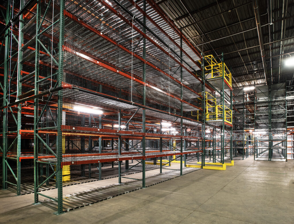 Warehouse catwalk system with in-rack lighting and sprinklers