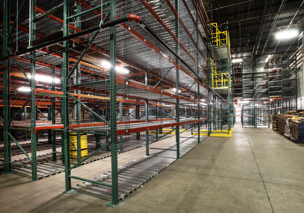 Warehouse fire safety systems integrated in a catwalk pallet racking system